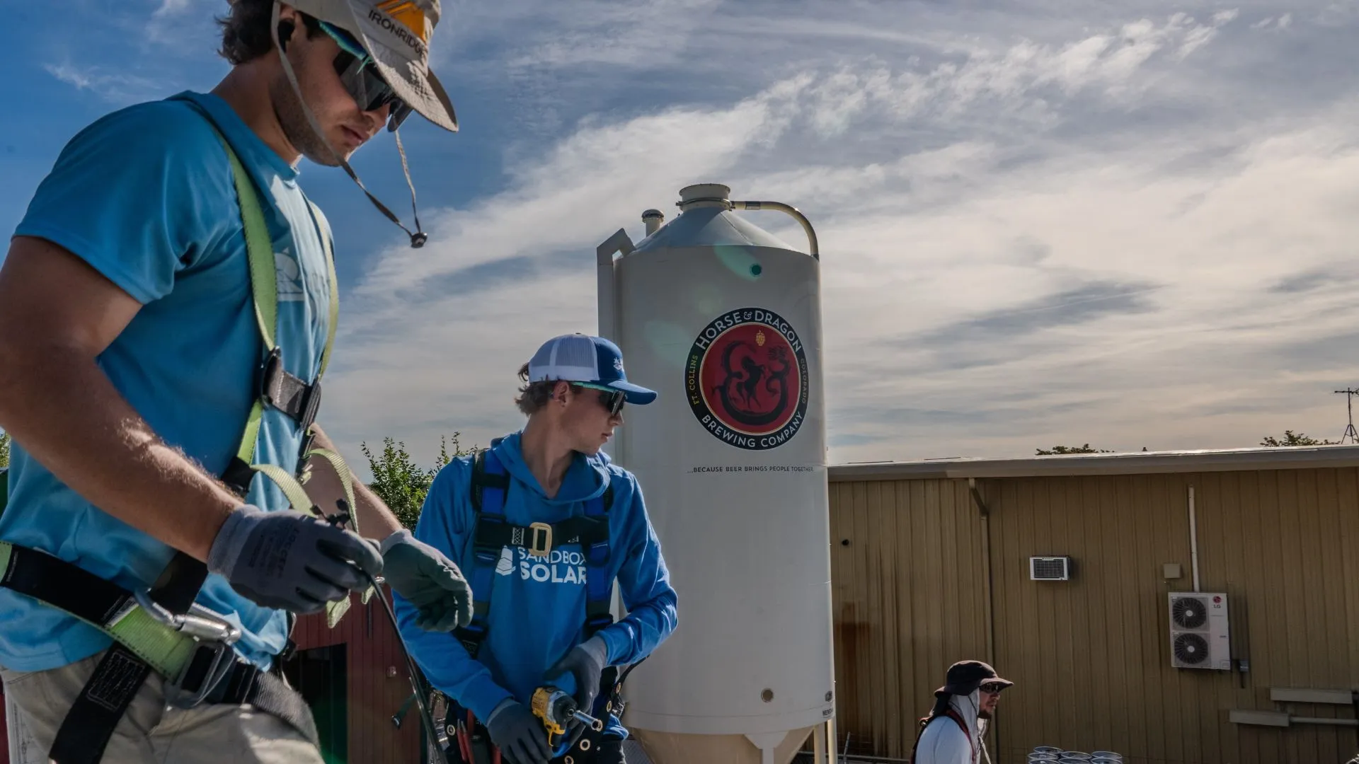 Commercial Solar Installers Working On A Rooftop Project
