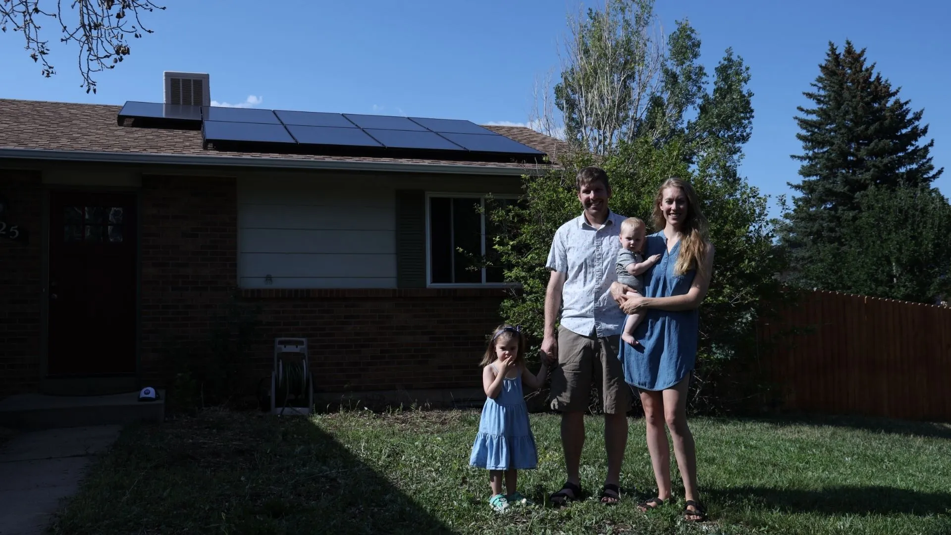Family With A Recently Installed Solar Array System
