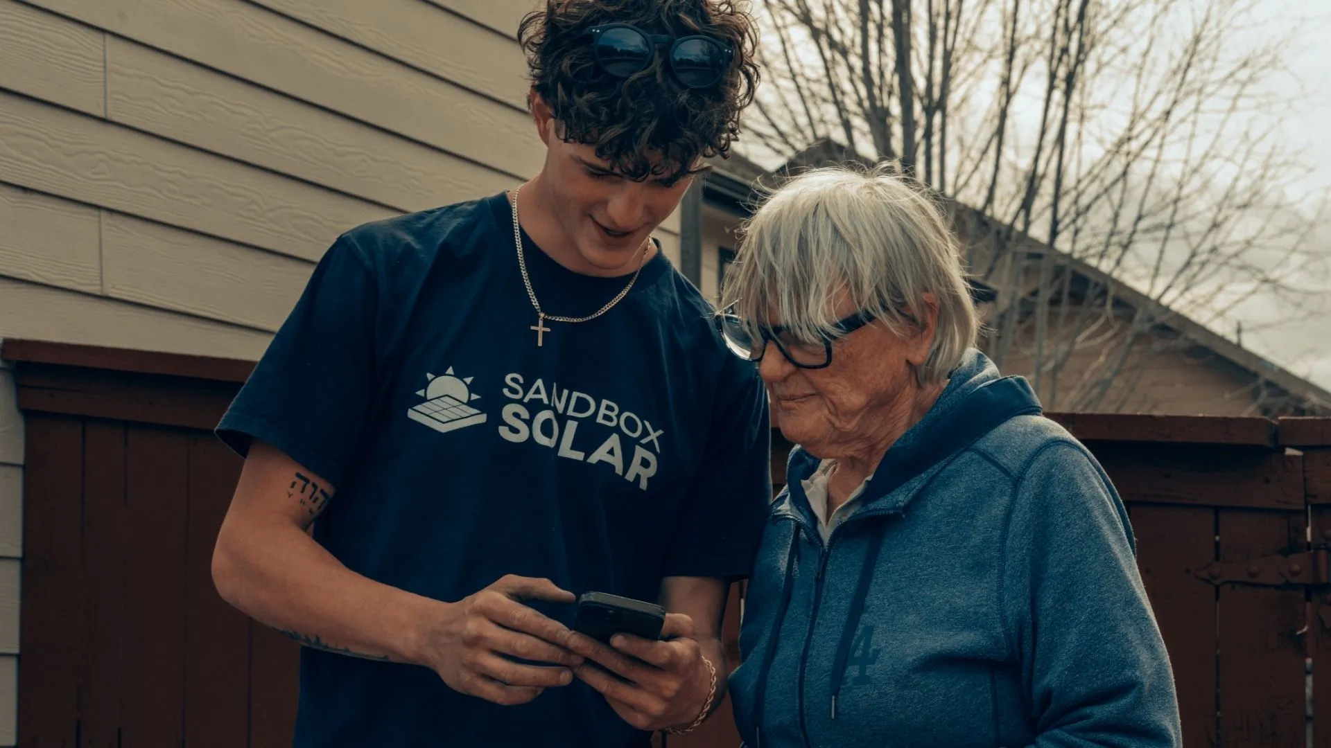 Solar Installer Talking To A Homeowner Solar Installer Talking To A Homeowner