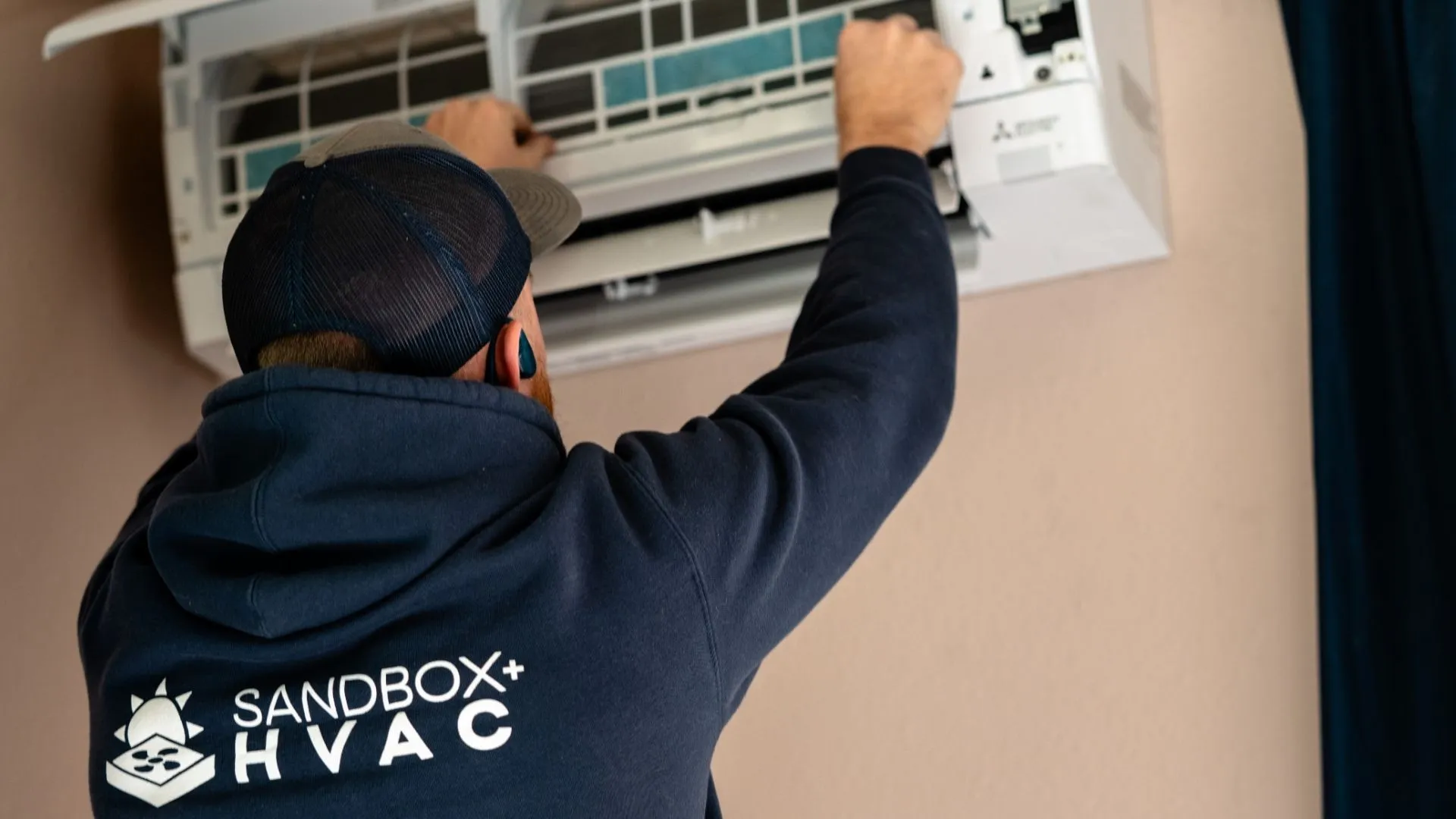 Mini-Split Indoor Unit Being Installed In A Home Mini-Split Indoor Unit Being Installed In A Home