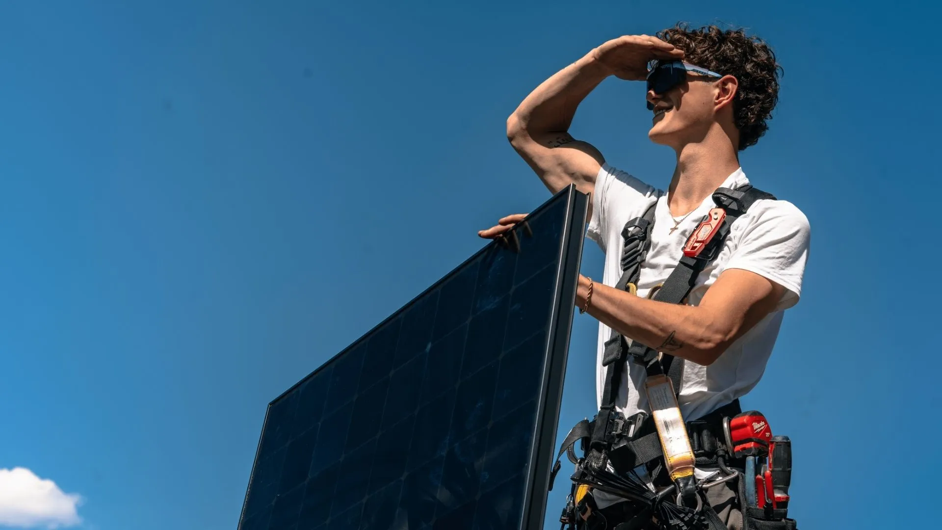 Trusted Solar Installer Working On A Rooftop PV System Trusted Solar Installer Working On A Rooftop PV System